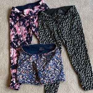 Sweaty Betty 3-pack.  Two 7/8 length Leggings and one 6” Short